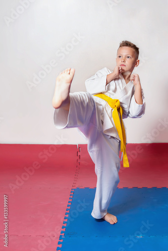 Children during training in karate. Fighting position photo