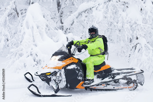 Man driving snowmobile