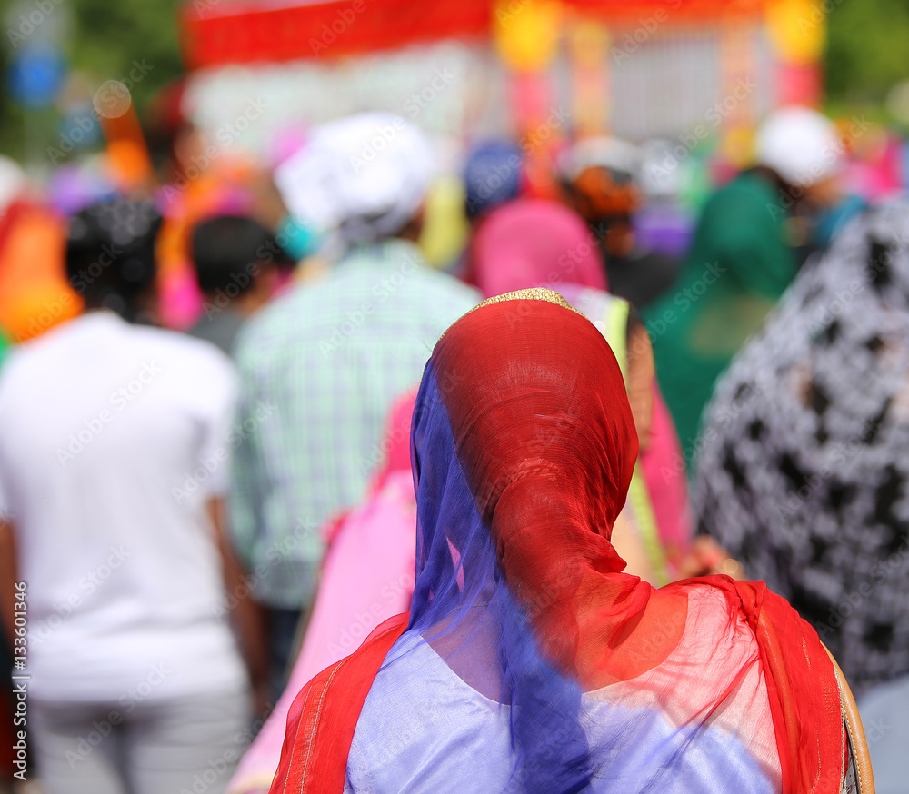woman with a headscarf to cover her head during a gathering of p woman with a headscarf to cover her head during a gathering of p