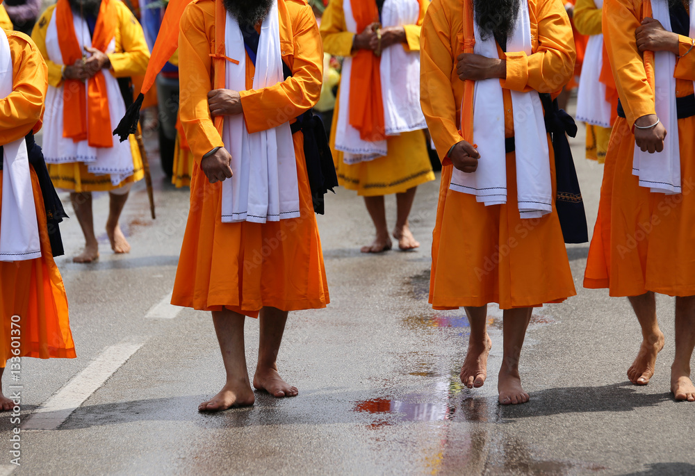 Men of Sikh religions they walk through the streets of the city