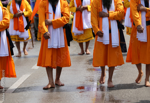 Men of Sikh religions they walk through the streets of the city