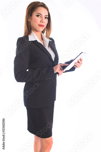 pretty businesswoman smiling using touch pad tablet isolated on