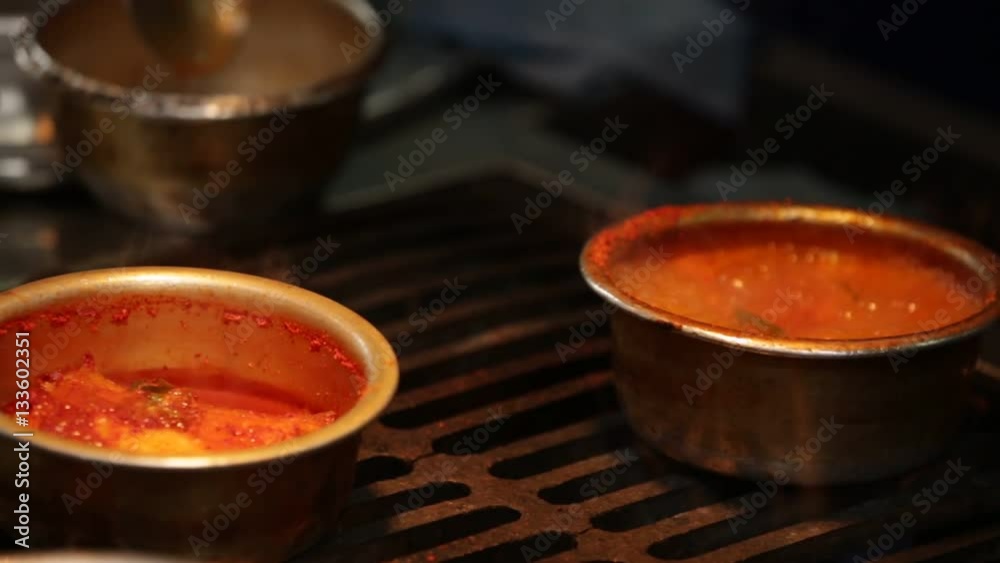 food seller prepares the dishes in Asian fish market. food seller prepares the dishes in Asian fish market.