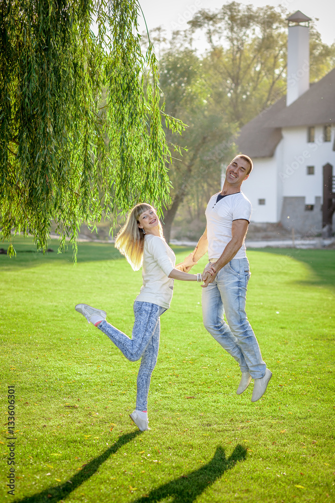 Young couple having fun with disc on a summer