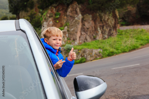 happy little boy loves to travel by car © nadezhda1906