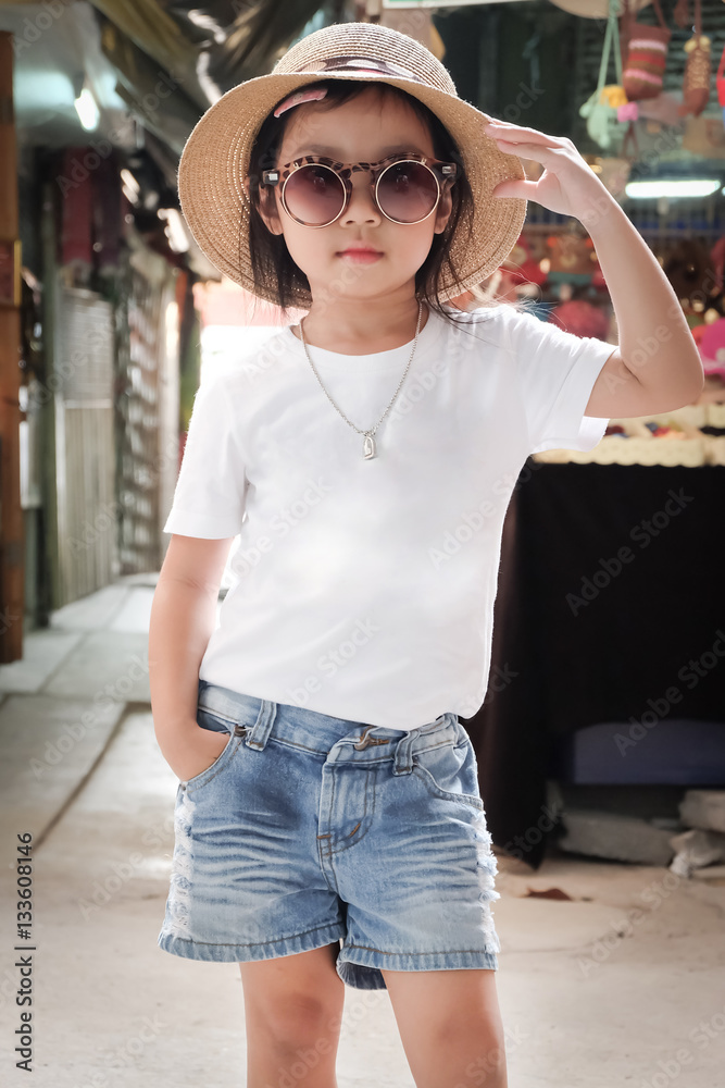 Asian girl wearing white t-shirt. Denim 