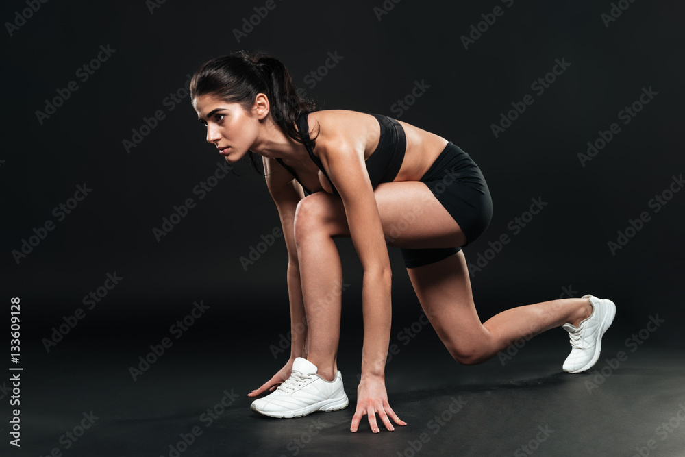 Portrait of a fit female athlete ready to run