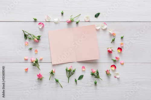 Valentine day background  paper card and flowers on white wood
