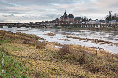 View of Gien and its castle from the banks of the Loire on a wintry sunset