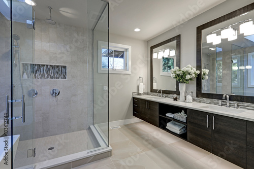 Spacious bathroom in gray tones with heated floors photo