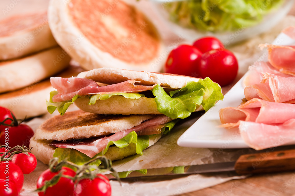 Tigella bread stuffed with ham and lettuce. Tigella bread stuffed with ham and lettuce.