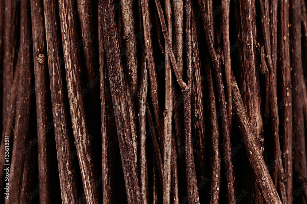 Thin brown dark wooden branches top view, wood background. Thin brown dark wooden branches top view, wood background.
