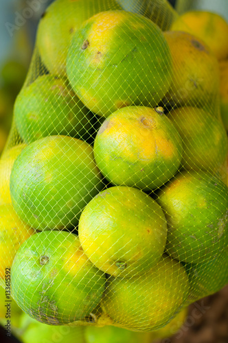 orange fruits in the market. orange fruit agriculture. orange fruit crops photo