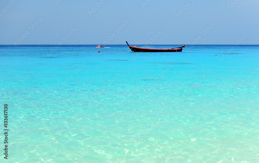 A boat on the horizon in the beautiful turquoise waters of the Similan islands, Koh, Similan, Phang Nga Province, Thailand, Asia