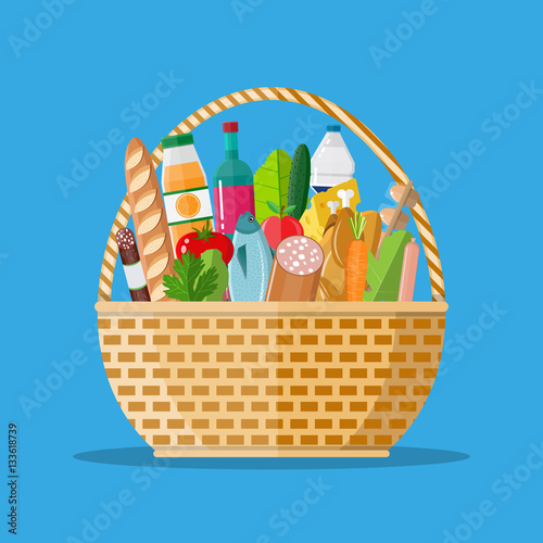 wicker basket full of groceries products