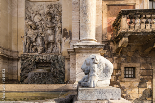 Rome, Italy. Detail of Fountain Acqua Felice (Moses Fountain) with a relief depicting scenes from the Bible, 1587 Egyptian lion with the name of the Pharaoh Nectanebo I, IV BC. photo