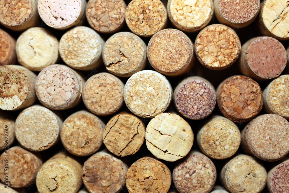Background of used wine corks. Wall of many different wine corks. Closeup of wine corks. Background of used wine corks. Wall of many different wine corks. Closeup of wine corks.