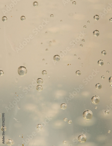 Water bubbles in a glass container close up