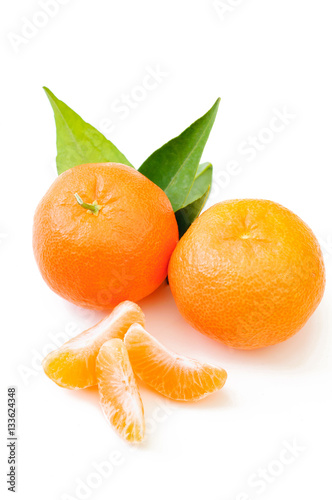 fresh mandarin with leaf and orange slices isolated 
