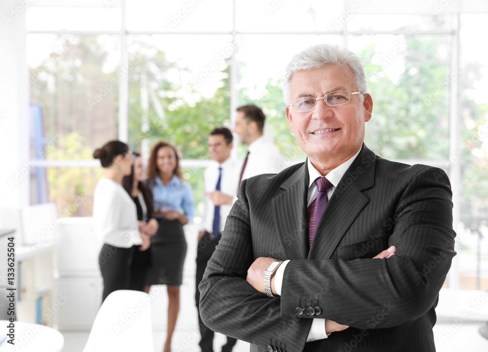 Business training concept. Portrait of handsome man standing in office