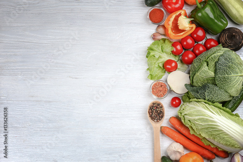 Fresh vegetables on wooden background, top view