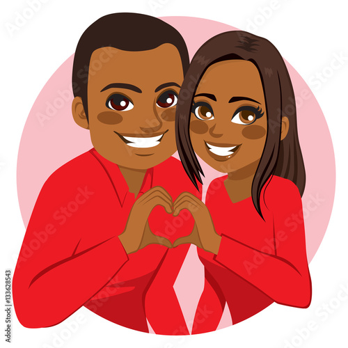 Sweet happy young African American couple making heart symbol joining hands on Valentine day