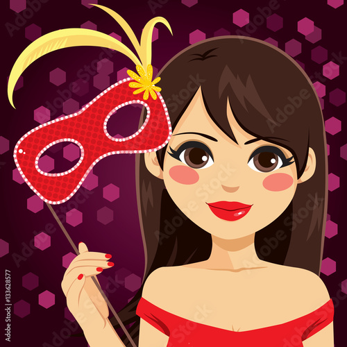 Beautiful young woman holdi...