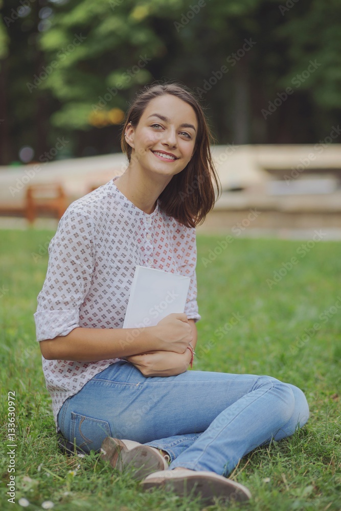 Cute young woman reading the book Cute young woman reading the book