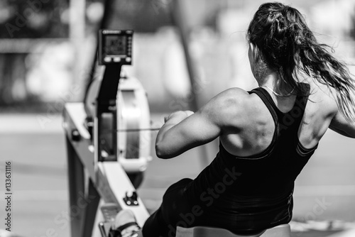 Woman on rowing machine on competition