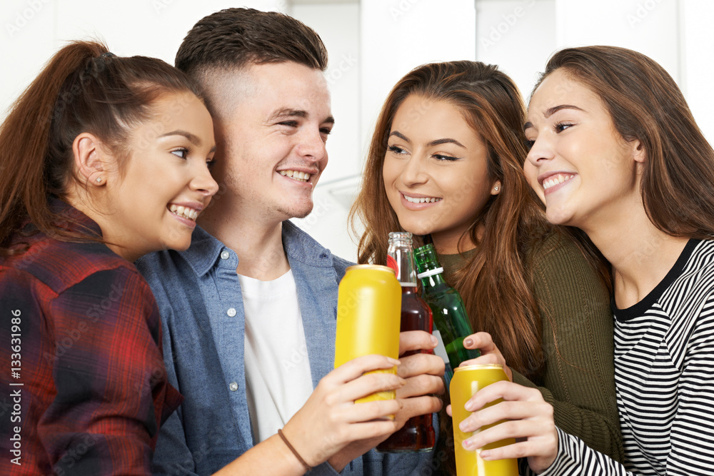 Group Of Teenagers Drinking Alcohol At Party Group Of Teenagers Drinking Alcohol At Party