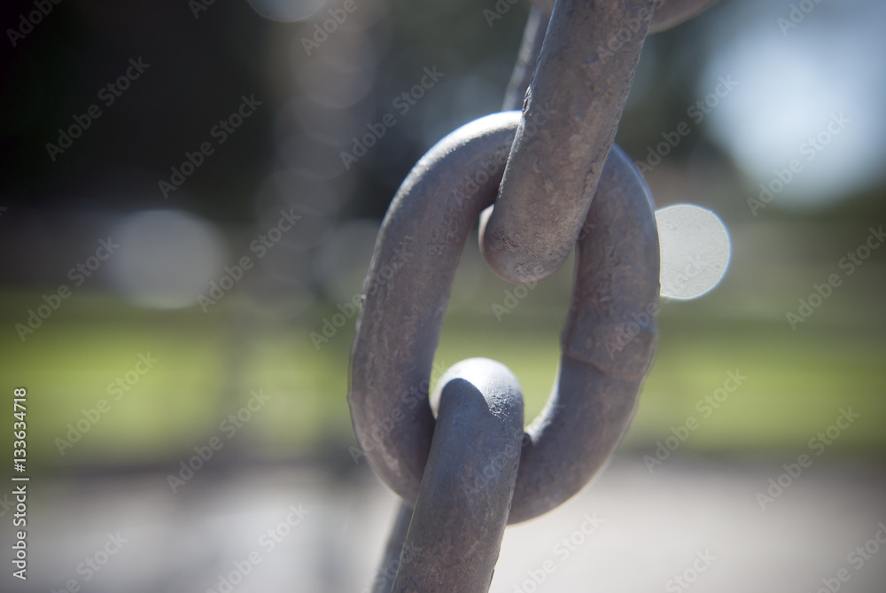 chain link in galvanized steel with a blurry background chain link in galvanized steel with a blurry background