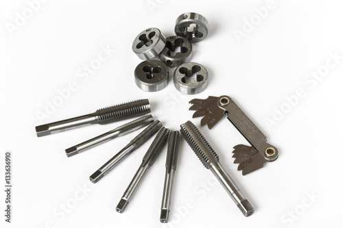 Professional mechanical hand tool set . Tap and die nuts for metal processing. © Freely