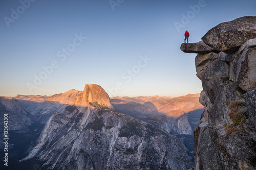 Obraz na płótnie Hiker at Glacier Point at sunset, Yosemite National Park, California, USA w salonie