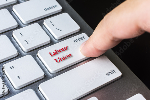 Finger on computer keyboard keys with Labour Union word photo