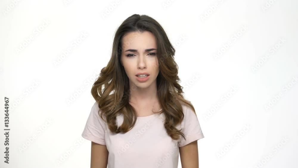 Shocked upset girl shouting and holding hands in hair isolated Shocked upset girl shouting and holding hands in hair isolated