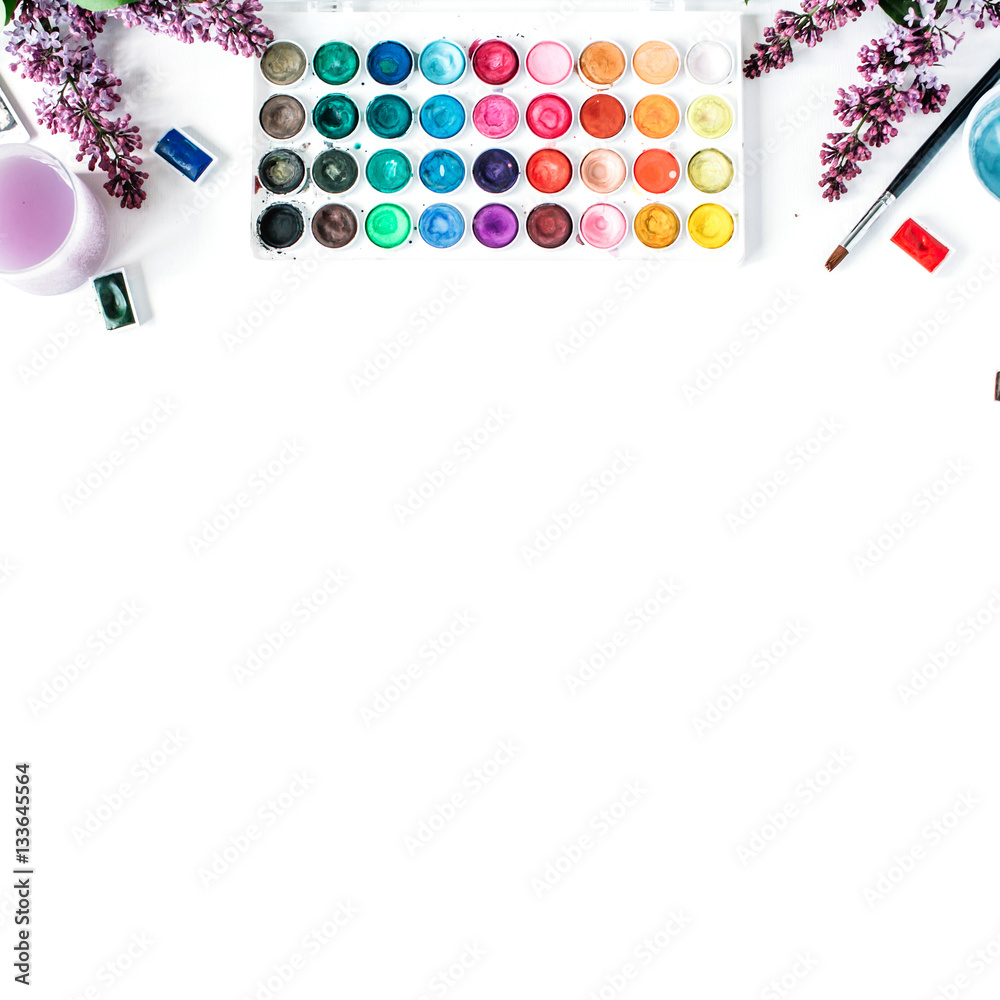 Obraz premium Artist workspace. Watercolor and brushes on white background. Flat lay, top view
