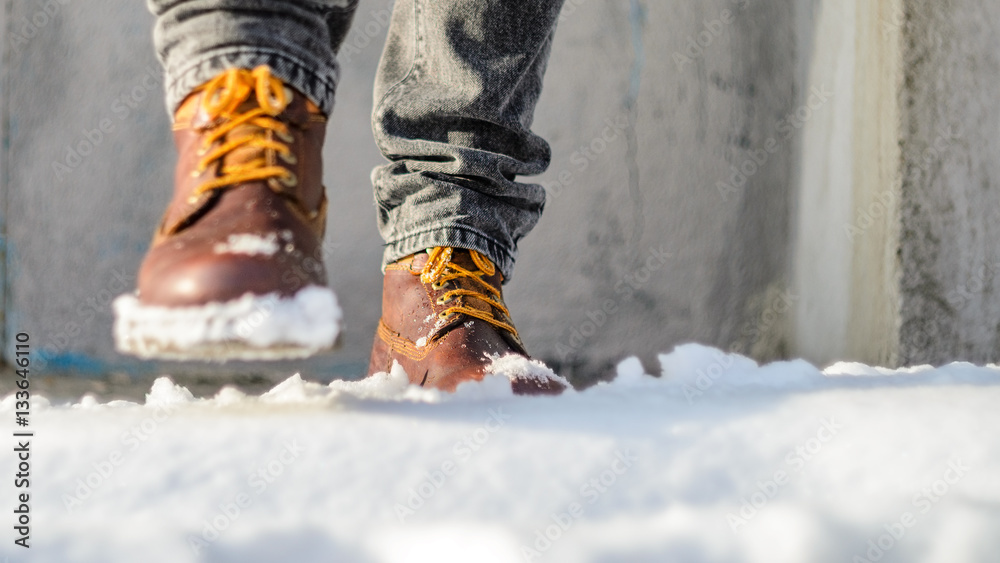 A man walks in the snow. Winter walks concept A man walks in the snow. Winter walks concept