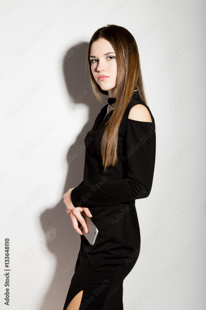 Fashion business beautiful young women in a little black dress with accessories Fashion business beautiful young women in a little black dress with accessories