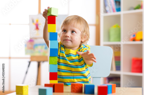child boy playing with bloc...