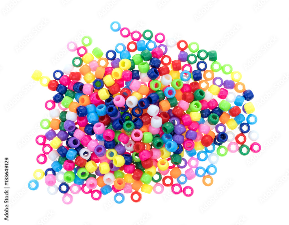 Pile of pony beads on a white background Pile of pony beads on a white background