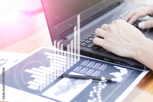 businessman hand working with new modern computer and business s