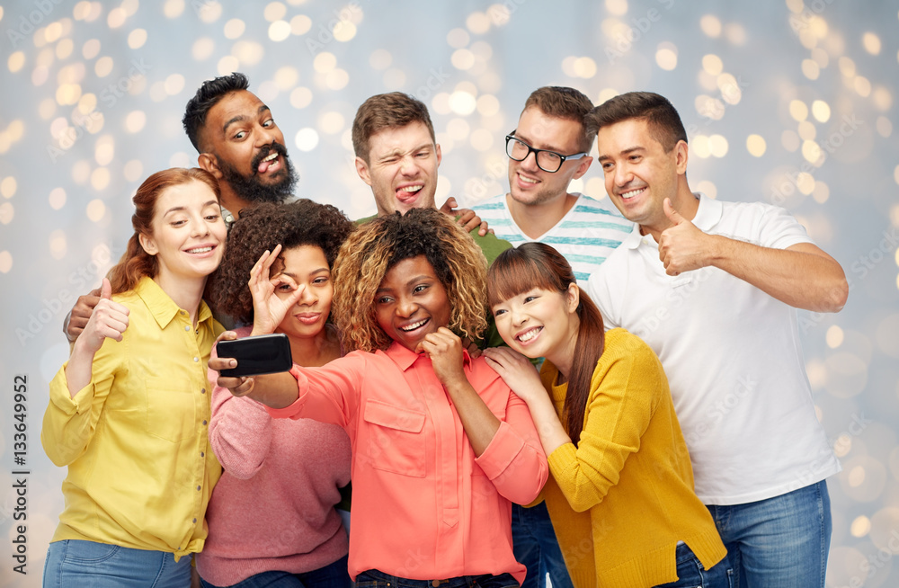 group of people taking selfie by smartphone group of people taking selfie by smartphone