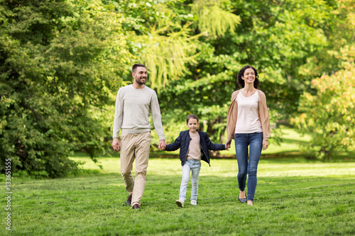 happy family walking in summer park