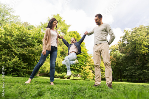 happy family walking in summer park and having fun