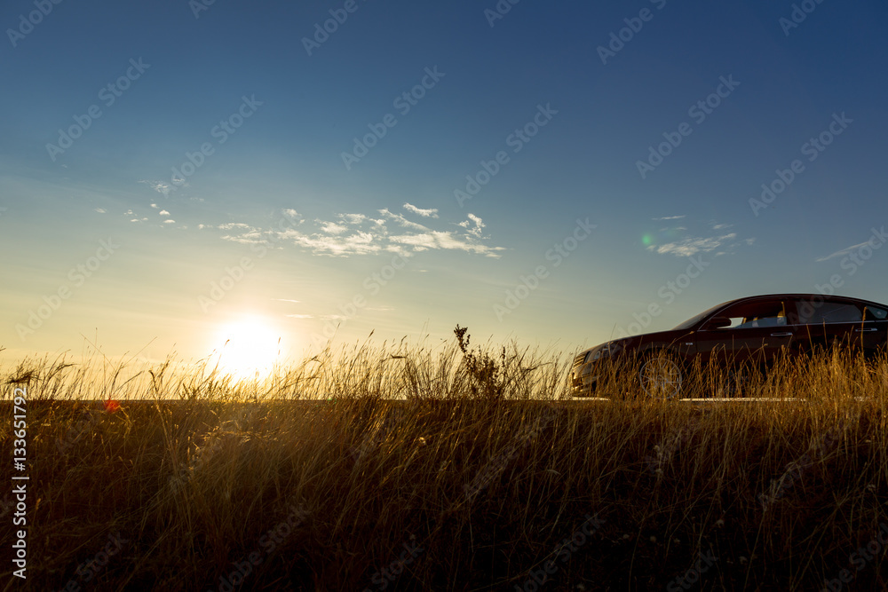 Silhouette car and bicycle in sunrise nature