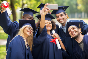 students or bachelors taking selfie by smartphone