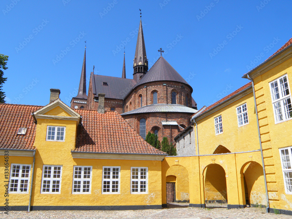 The Yellow Palace and Cathedral of St. Luke (Roskilde Cathedral) under Vivid Blue Sky, Roskilde, Denmark 
