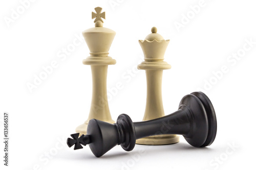 Chess business concept, leader & success. White king and queen above defeated black king