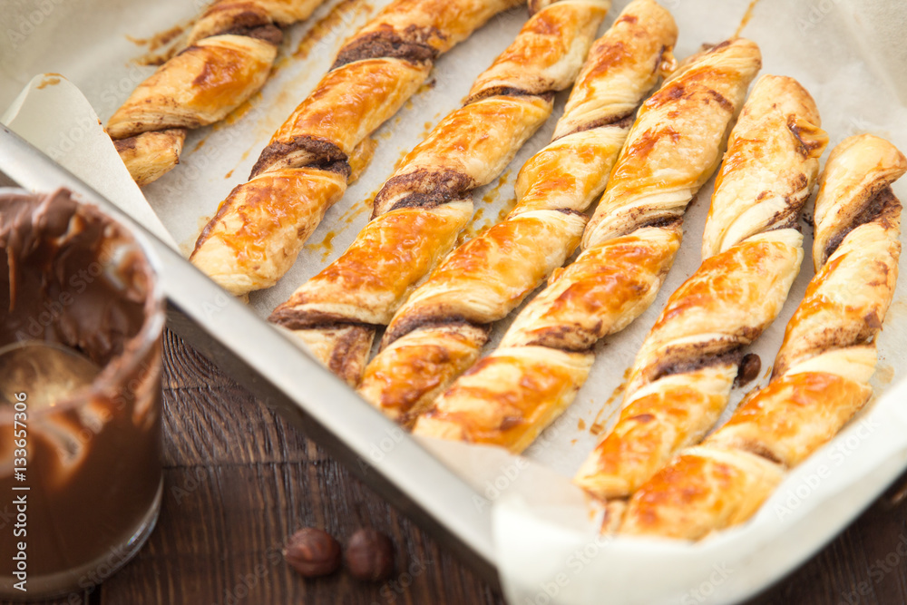 homemade cakes - puff pastry with chocolate paste. twisted cakes homemade cakes - puff pastry with chocolate paste. twisted cakes