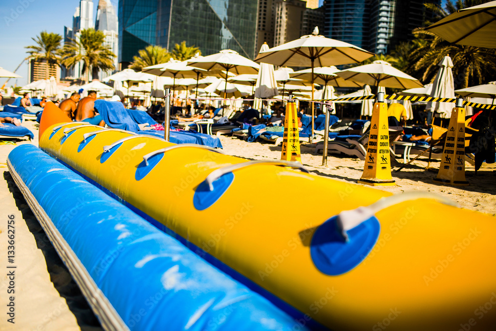Blue and yellow air tube for riding on sea waves